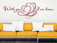 Liebesspruch Wandtattoo With you I am home über dem Sofa