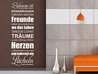 Spruchbanner Wandtattoo Zuhause ist wo die Liebe in weiß auf dunklem Hintergrund