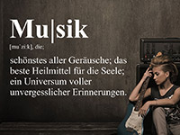 modernes Wandtattoo Musik Definition auf dunklem Hintergrund